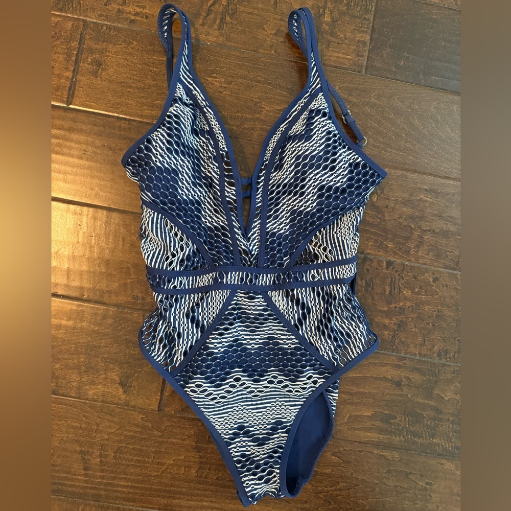 Becca color play navy white one piece